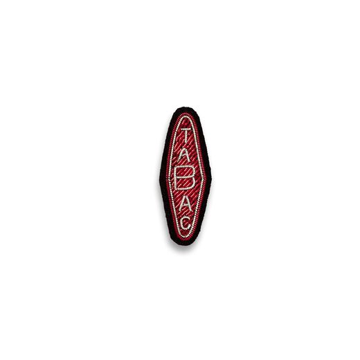 Embroidered brooch with parisian tabac sign